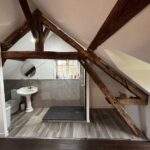 Aménagement de combles d'une maison à Vierzon (18) - salle de bain ouverte sur chambre sous combles