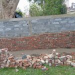 Rénovation d’un mur mitoyen à Lille (59) - mur en briques en cours de construction