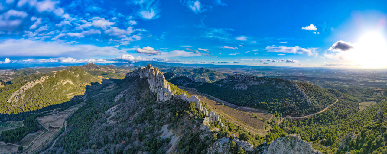 Aerial view of les Dentelles de Montmirail in front of the Mont Ventoux in the french alps